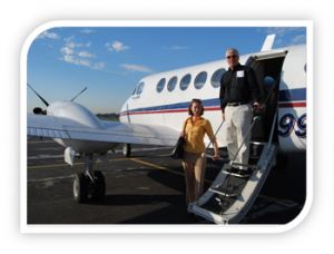 woman and man exiting a chartered plane